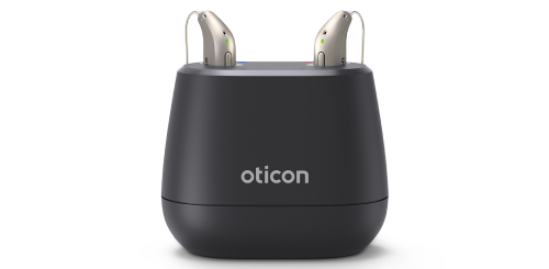 Oticon rechargeable hearing aids pictured with their chargers