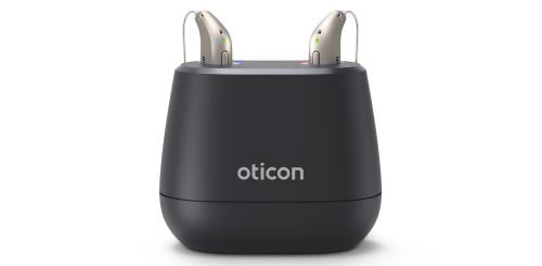 Oticon rechargeable hearing aids pictured with their chargers